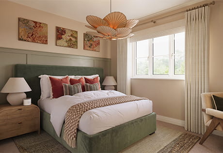 Contemporary designed bedroom in neutral beige tones, floral decorations, carpet and rug.