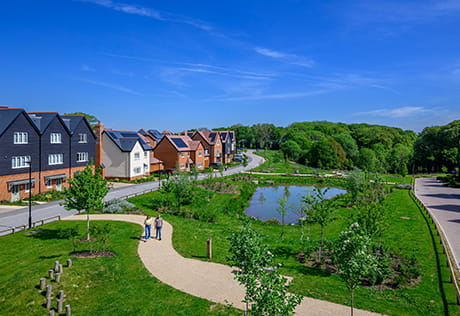 An exterior photograph of the green space and buildings at Abbey Barn Park