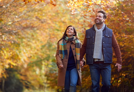 Couple on a nature walk around Abbey Barn Park