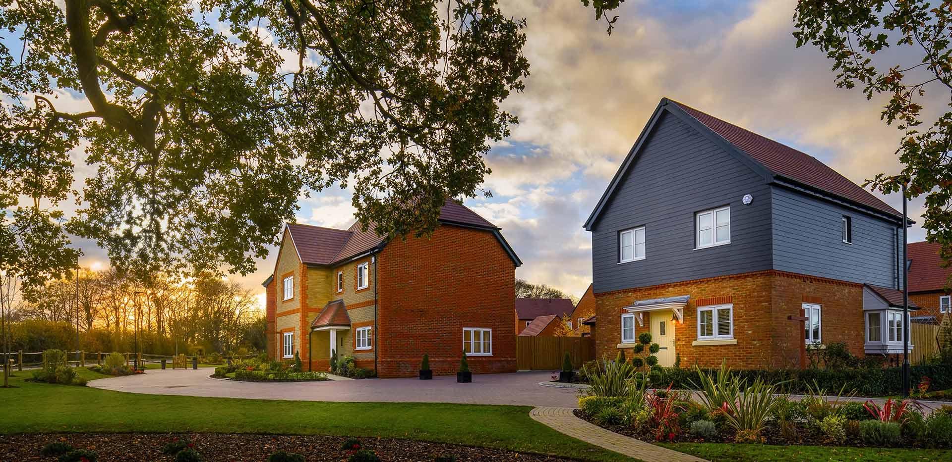An exterior image of houses at Abbey Barn Park at Dusk