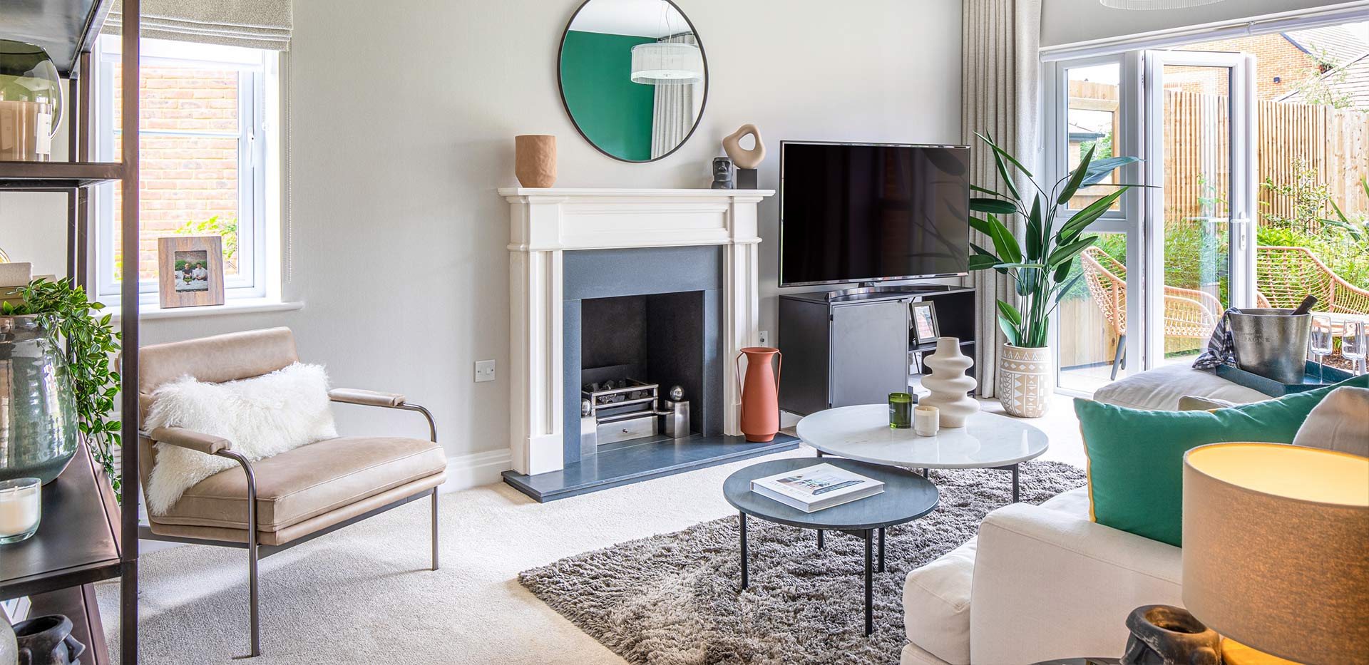 An interior Living room image showing the sofa, fireplace and TV