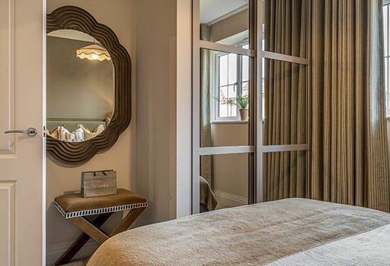 An interior Bedroom image showing desk and wardrobe