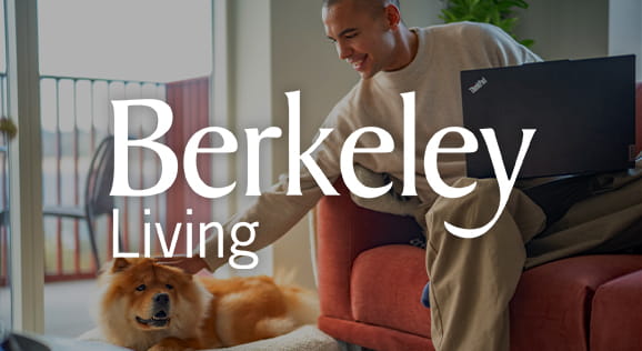 An image of a man petting his dog in his new rented home with Berkeley Living