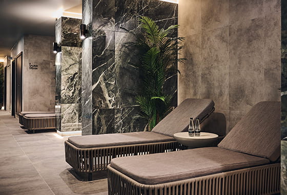 An image of the relaxation loungers around the swimming pool at The Park Club