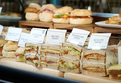 Closeup of a sandwich bar display at a café coffee shop.