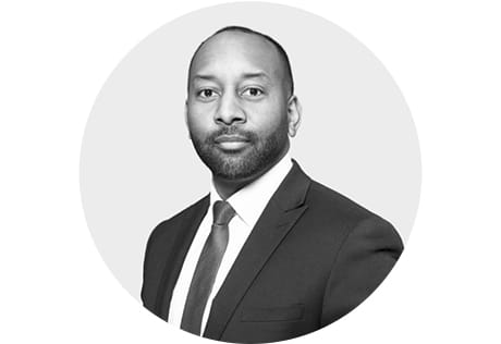 Headshot photo of Bradley in greyscale