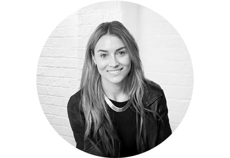 Headshot photo of Tali in greyscale