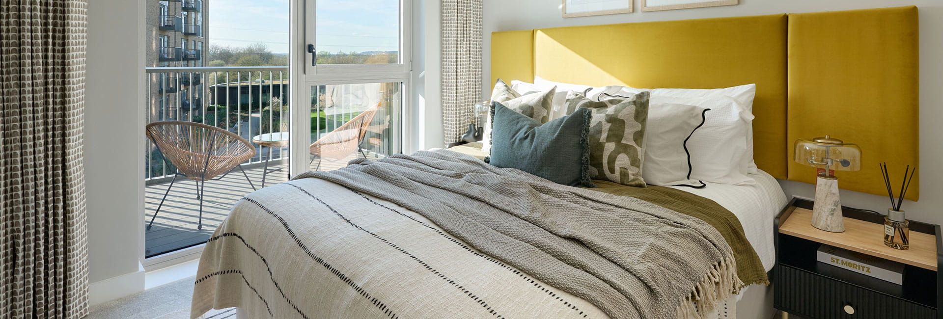 Light bedroom with balcony and city views, property 2.4.1