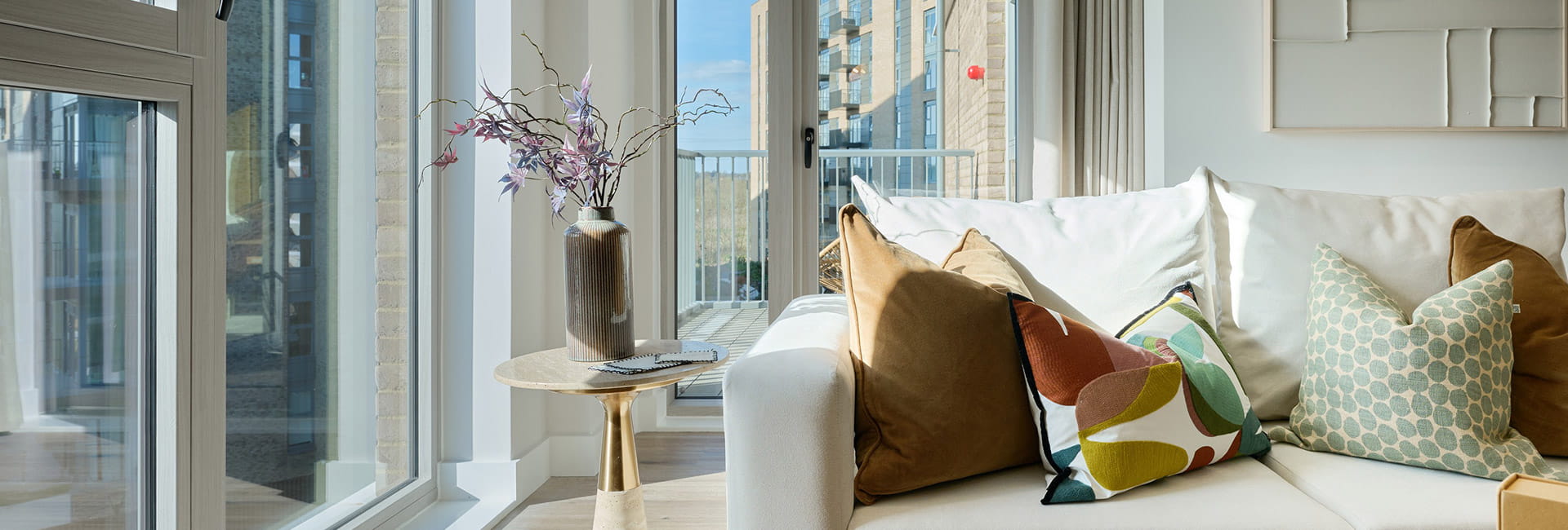 Spacious living area with full length windows overlooking the city, property 2.4.1