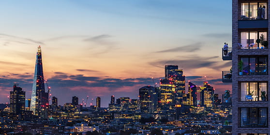An exterior image of Bermondsey Place at dusk with stunning London skyline views