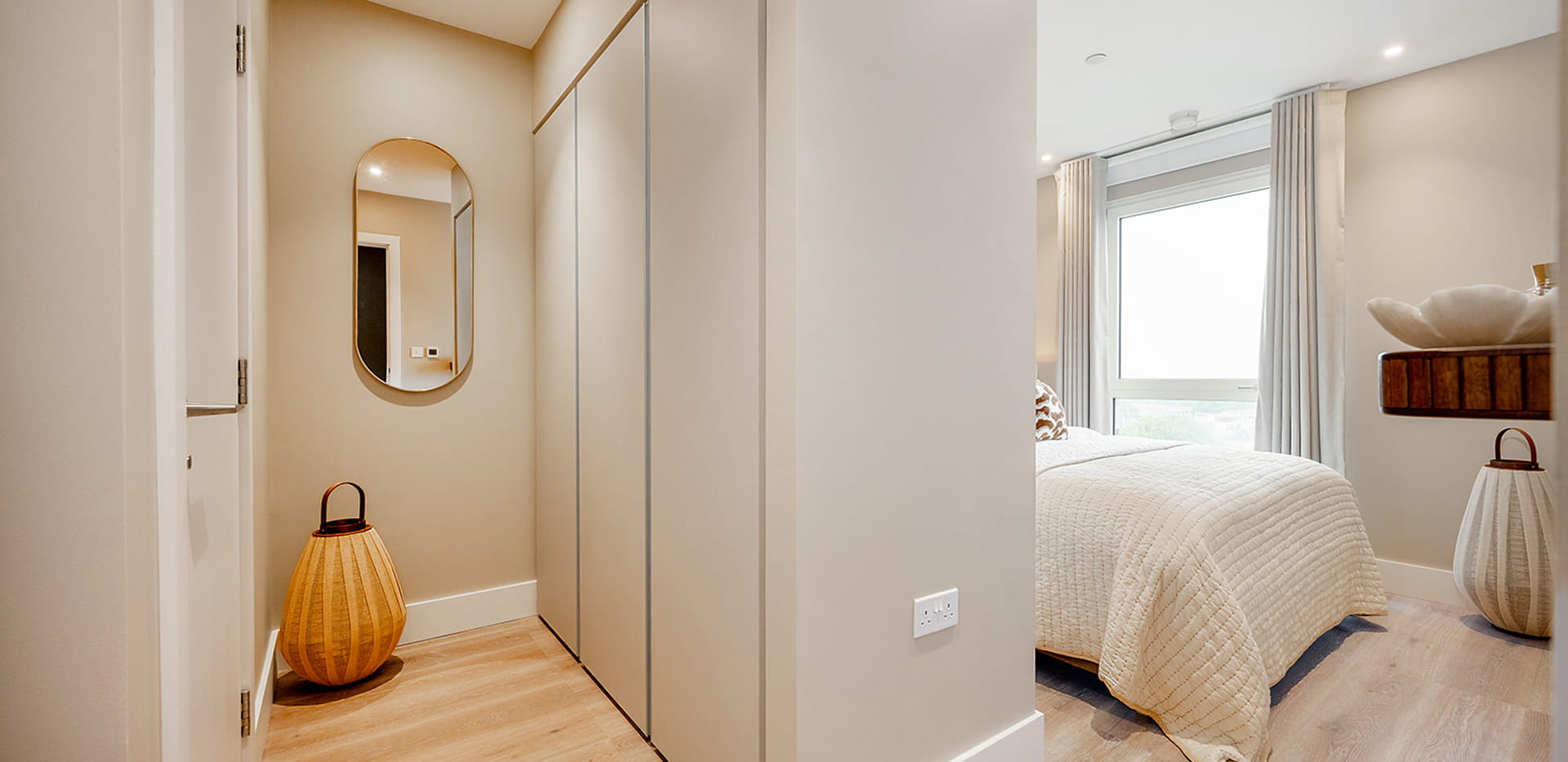 Beige panelled walls of hallway leading to bedroom.