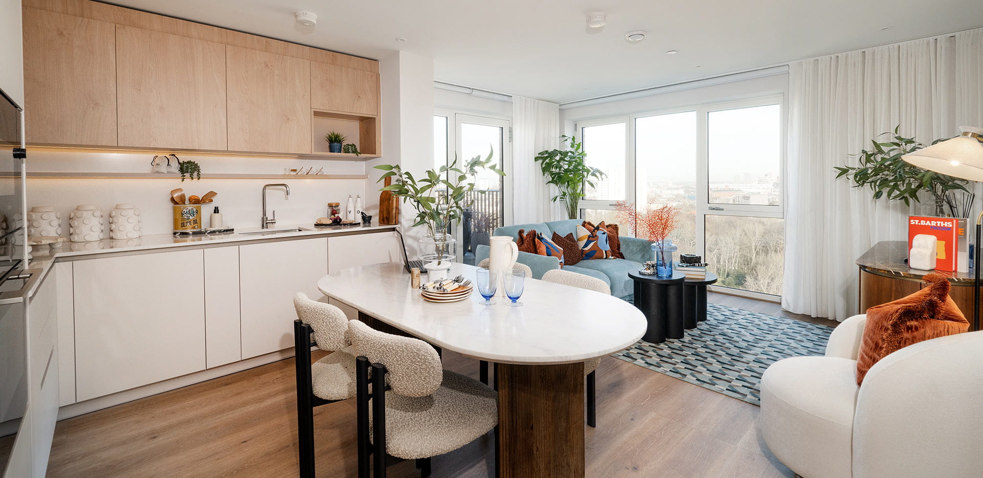 An image of the kitchen-dining from a 2-bedroom showhome at Bow Green