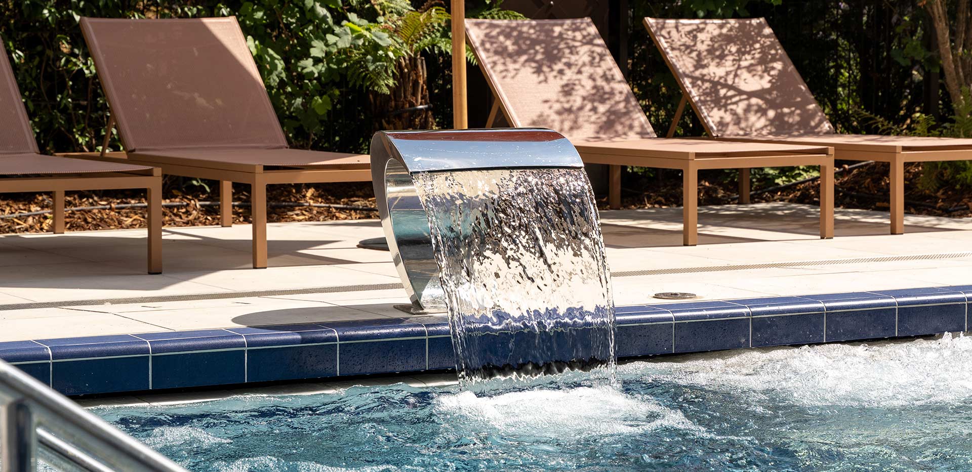 Bow Green, outdoor pool and water feature in the sun