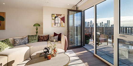 An exterior image of Bow Green apartments with London in the background