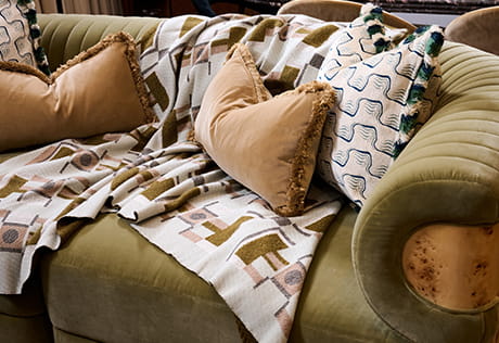 An image of a close up of a sofa with pillows