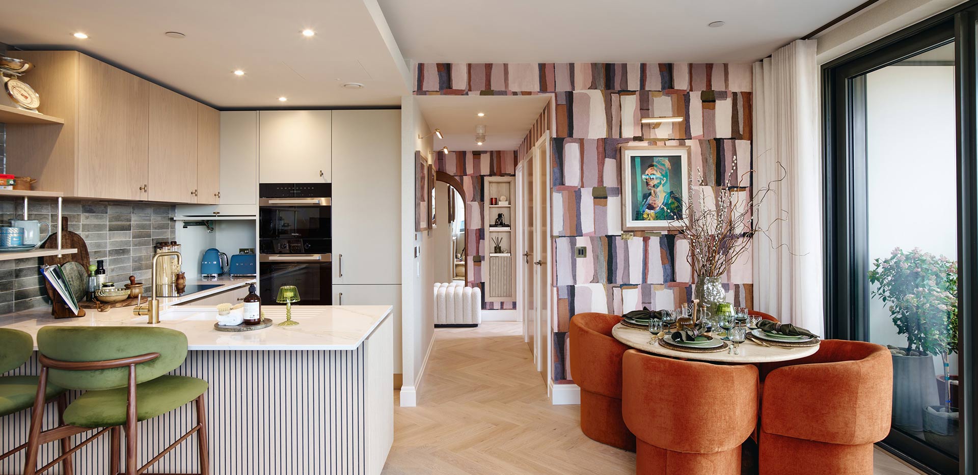 Kitchen with a neutral colour palette and dining area beside it