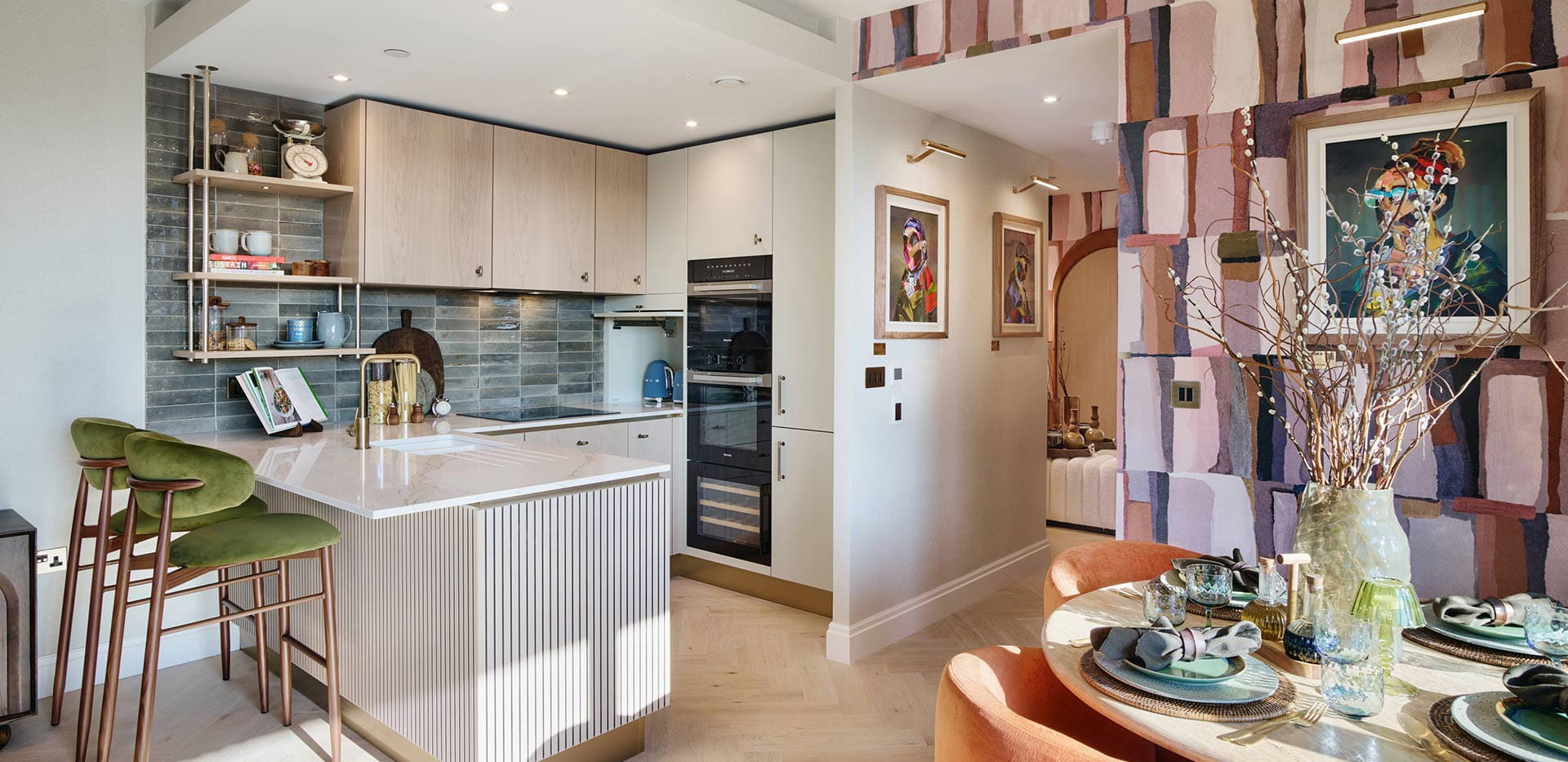Kitchen with a neutral colour palette and dining area beside it
