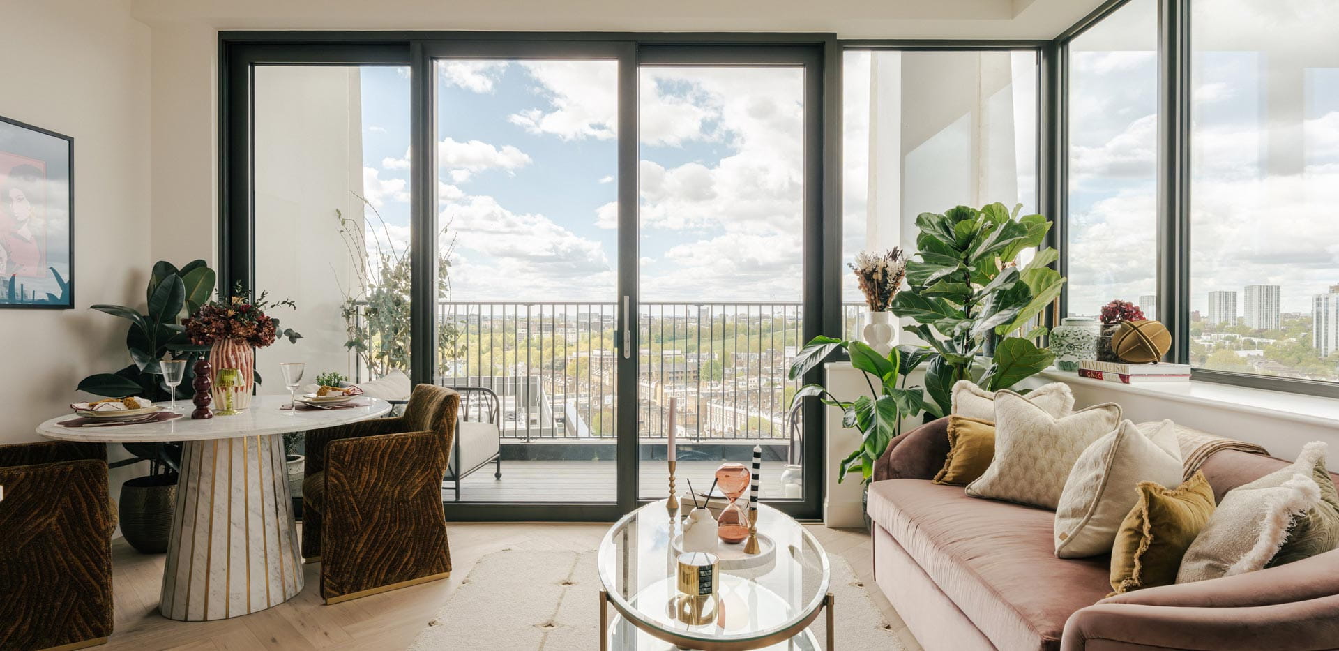Modern designed and decorated living room dining area with wraparound windows and balcony doors.