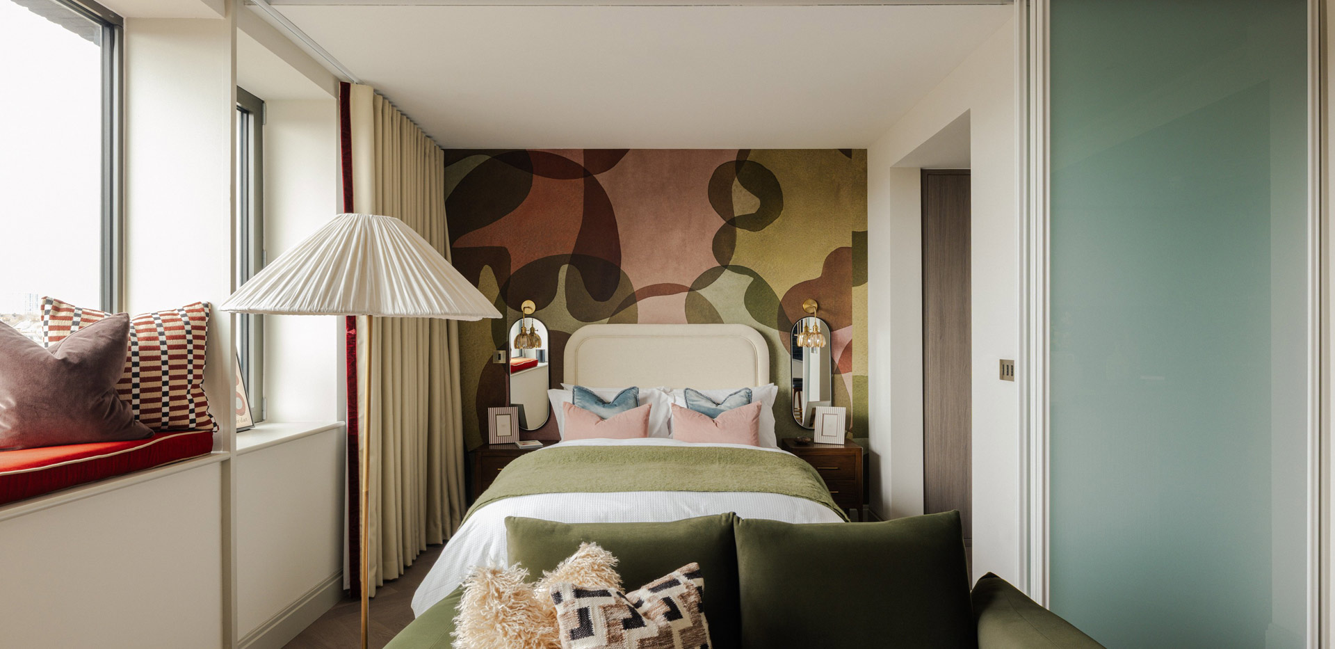 Double bed, bedside tables and wide window for ample natural lighting.