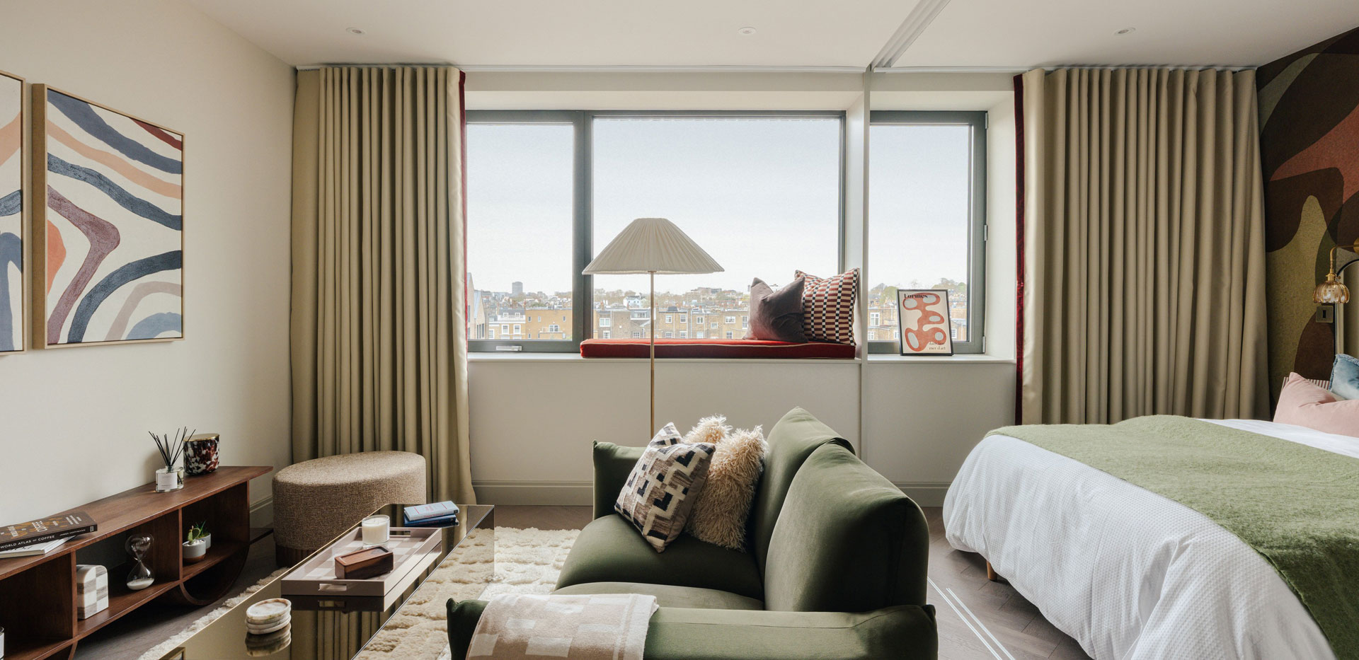 Double bed, seating area, wide window.