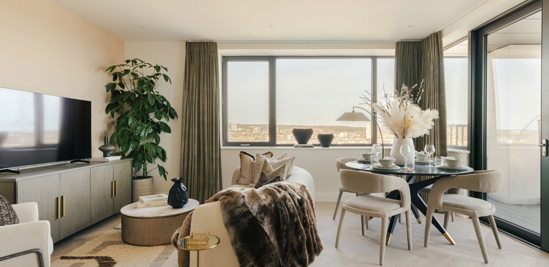 Living dining space combined, ample natural lighting from wide windows.