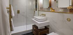 Chelsea Creek Westwood House bathroom with a light, marble design