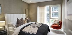 Chelsea Creek Westwood House bedroom with a central double bed and a dark design