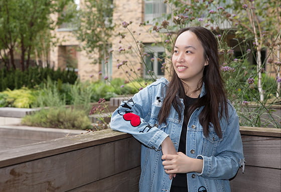 An image of Aurora on the balcony on their new home