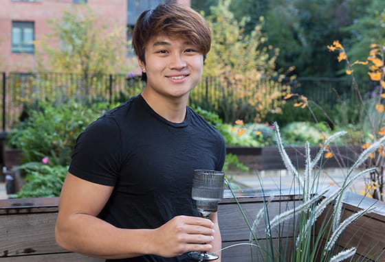 An image of Chi out on his balcony at his new home