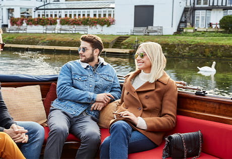 An image of a couple enjoying a boat trip 