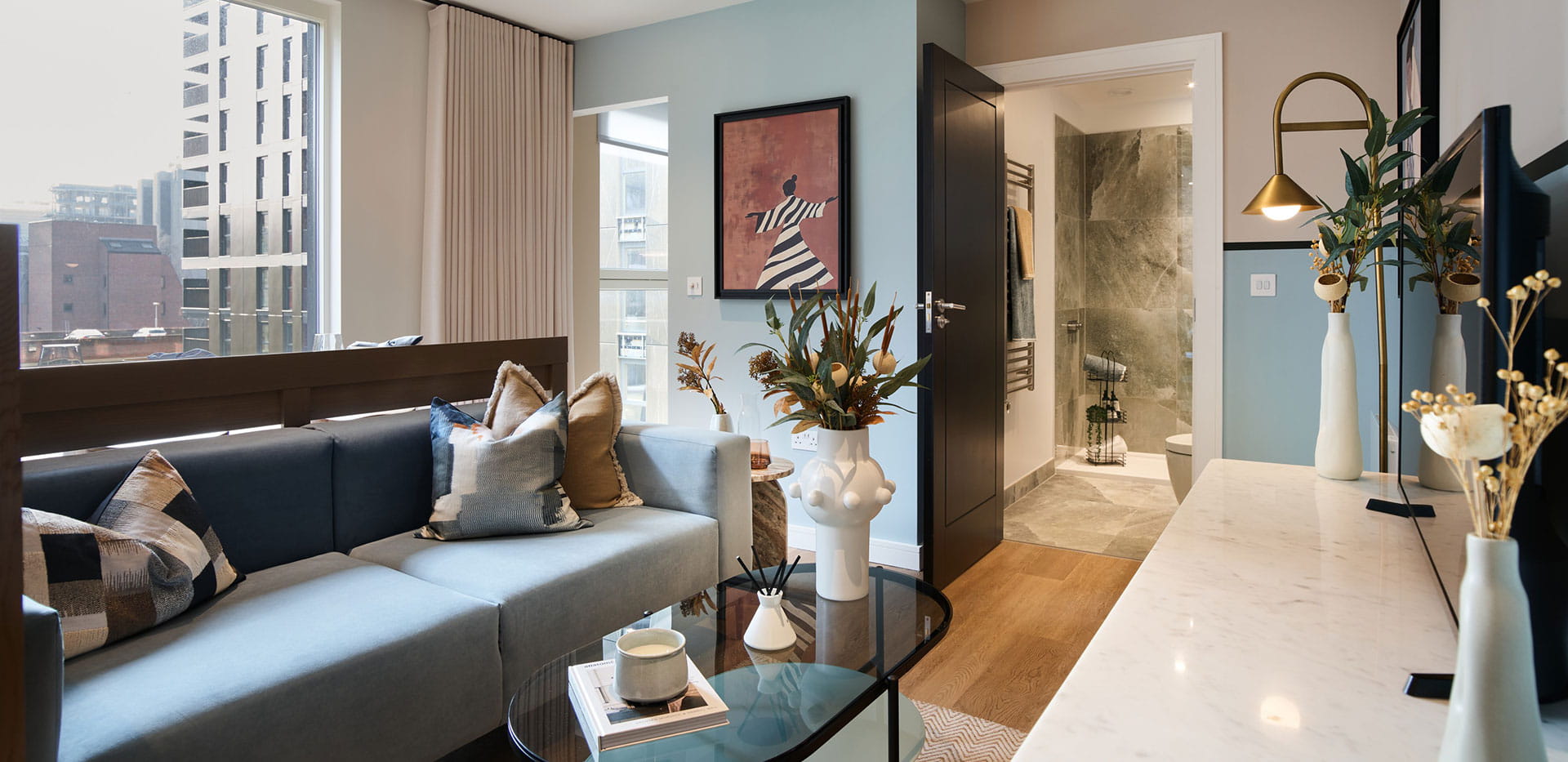 An image of the living area showing the bathroom entrance within Show Apartment D3.5 at Eden Grove