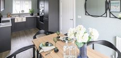 Kitchen area with black and white furnishings