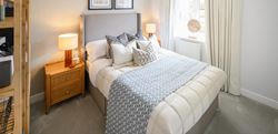 Foal Hurst Green bedroom with a central double bed and neutral design