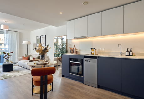 Extended kitchen dining area, living space in background.