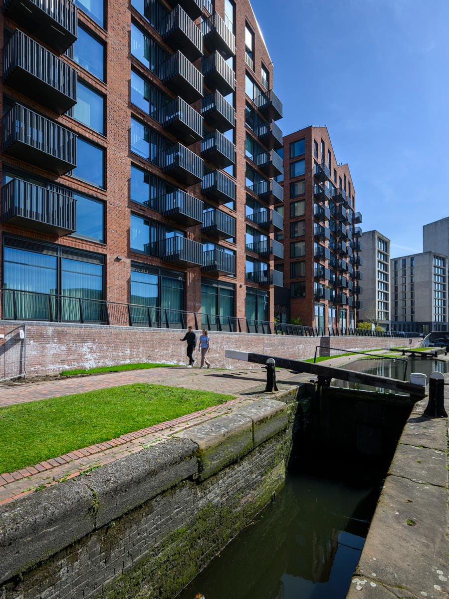 Closeup of canal weir and paved sidings