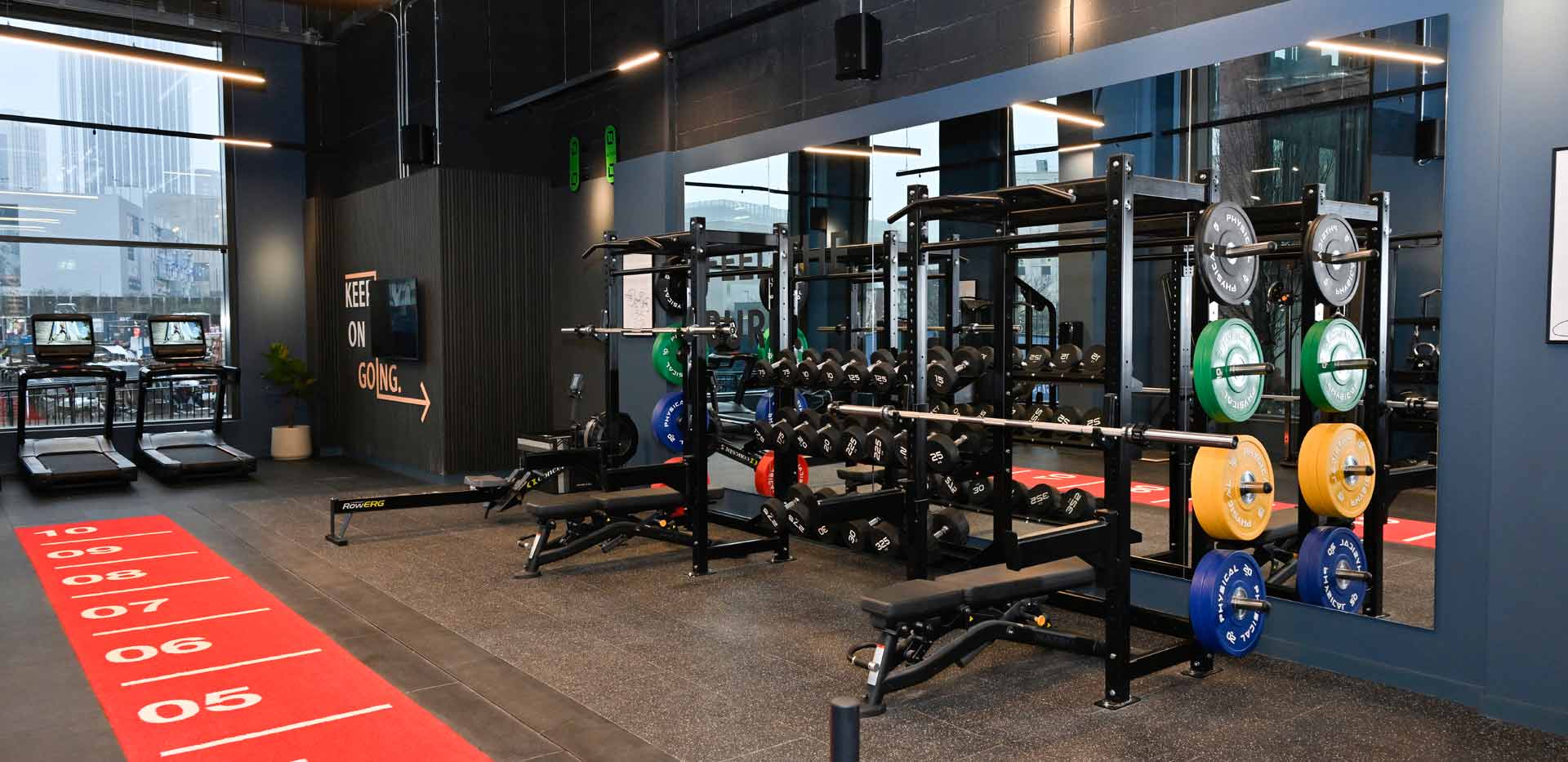 Glasswater Locks resident's facilities showing indoor gym free weights and treadmills