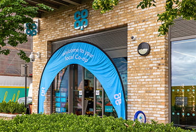Co-op convenience shopping store with Co-op branded signage out front.