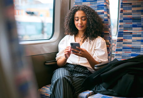 An image of a person sat on the train