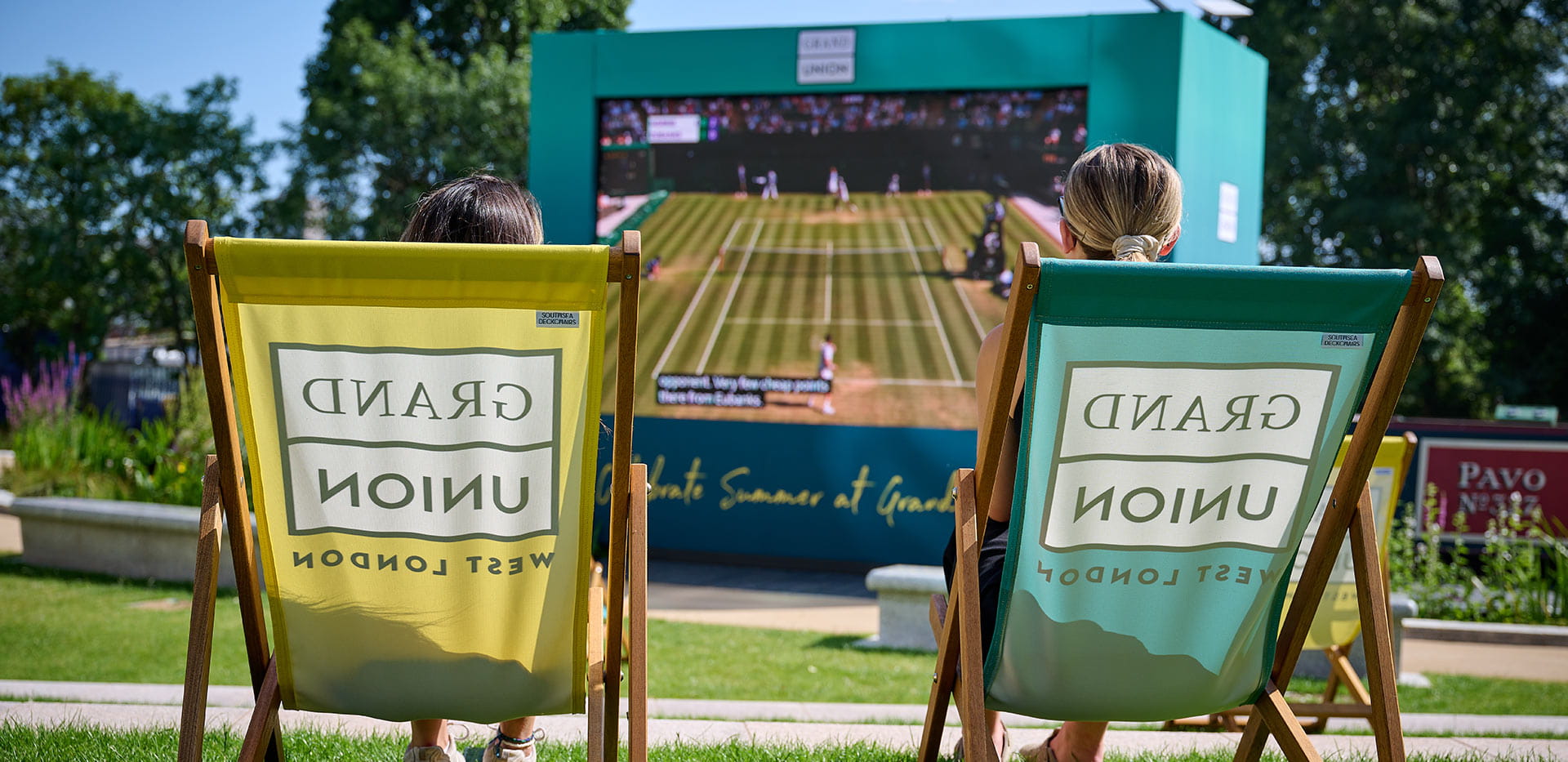 Image of residents watching tennis at the canalside cinema at Grand Union