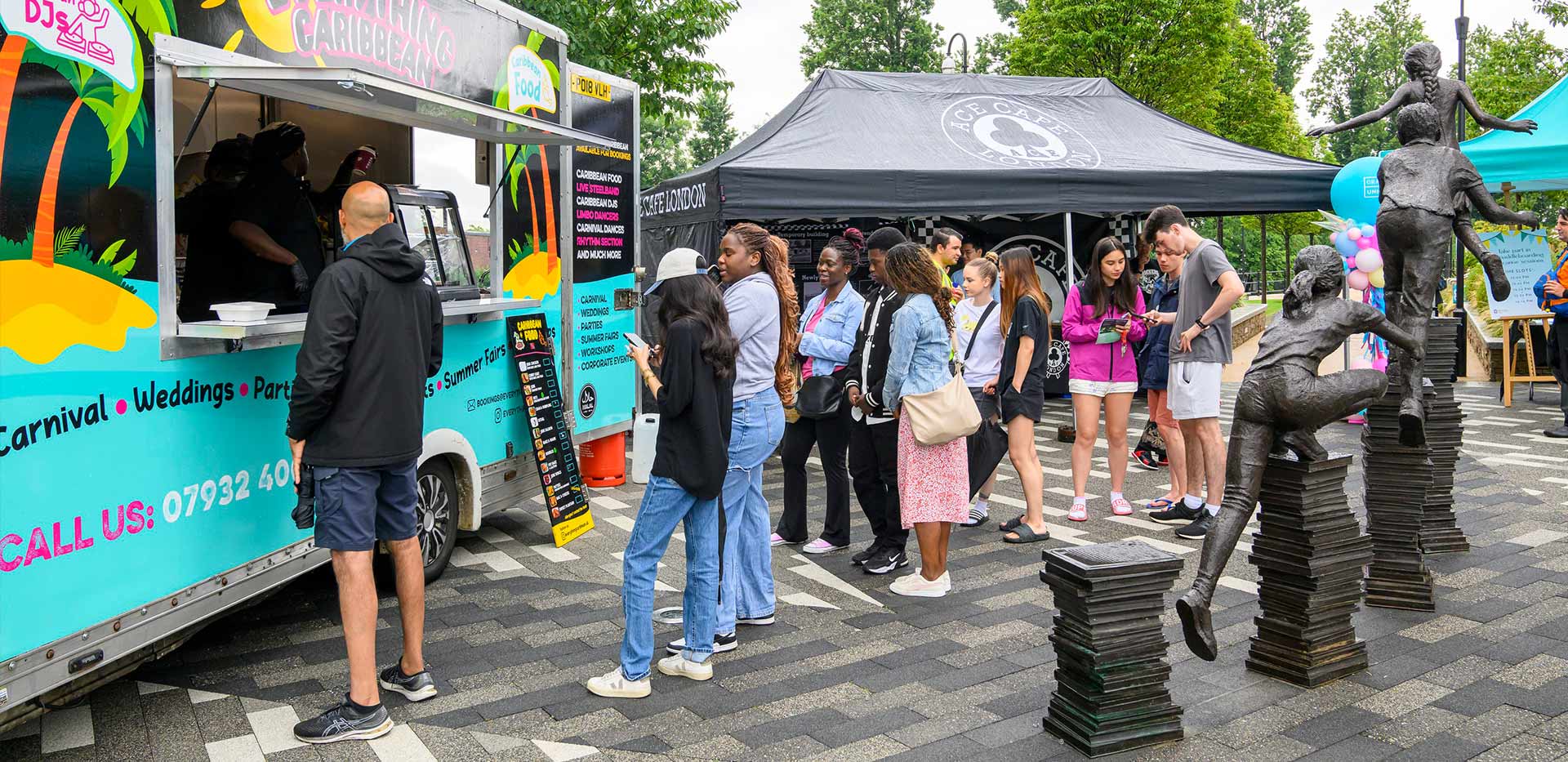 An image of people queuing up for the food at the Grand Union Summer festival