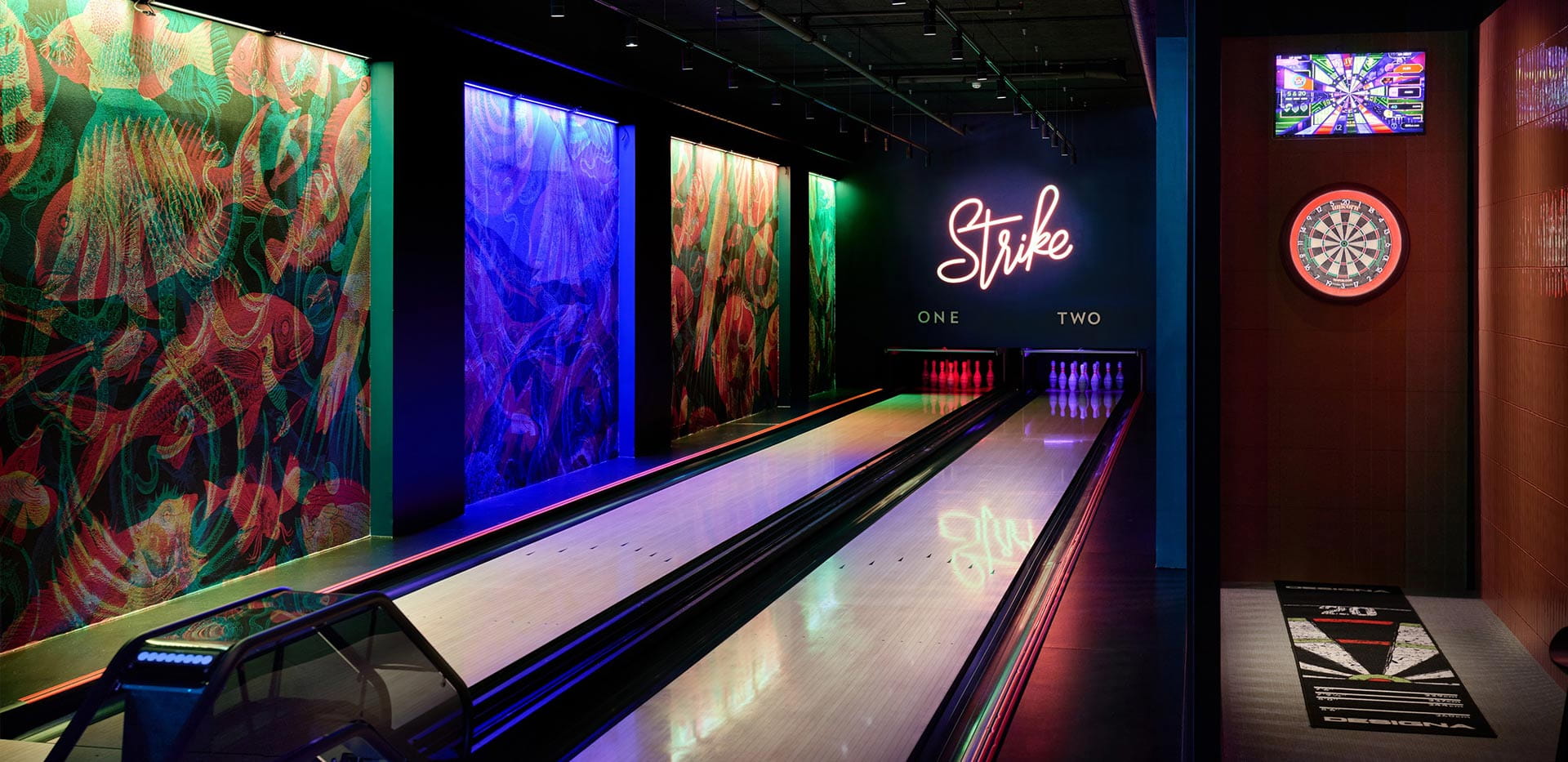 An image of the bowling alley and the e-darts next to each other at Grand Union