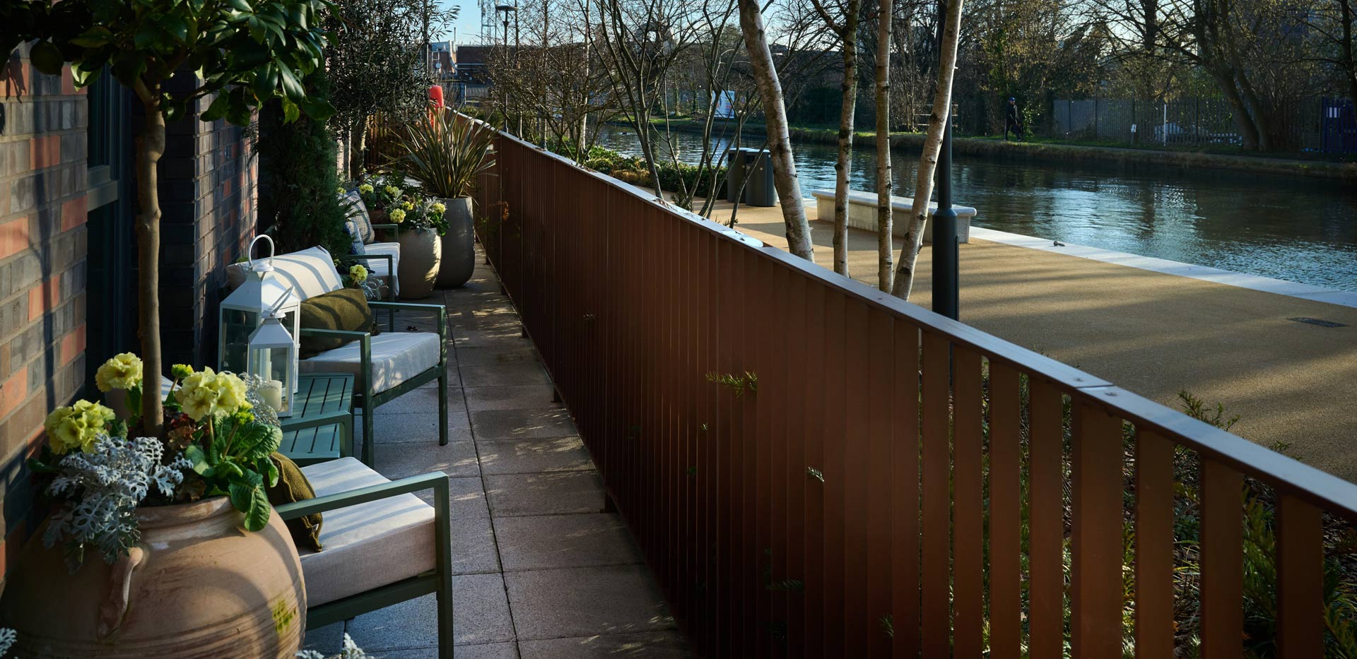 Outdoor terrace on ground level, overlooking canal