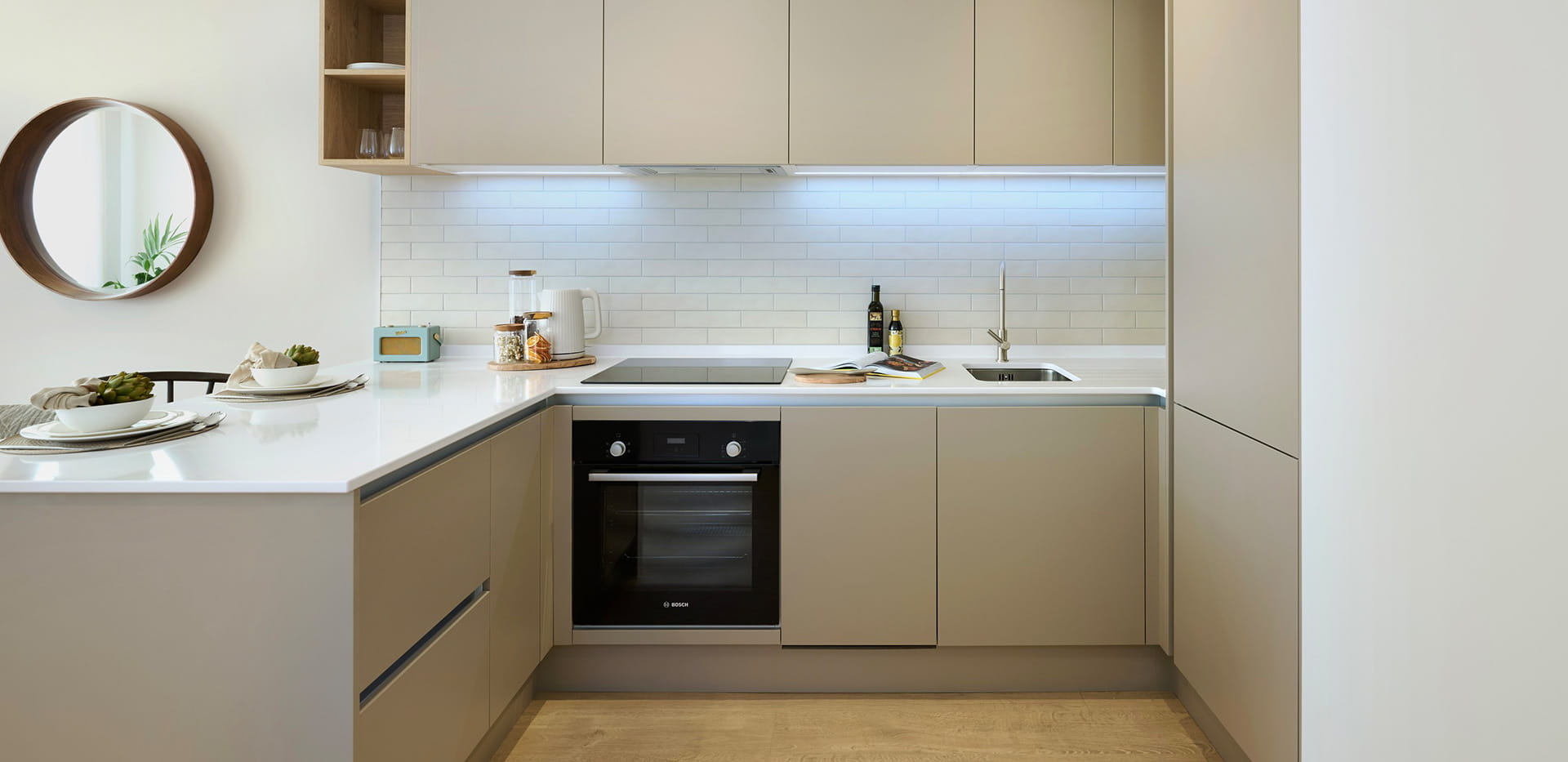 The Cedar, kitchen with light grey design and white marble worktops