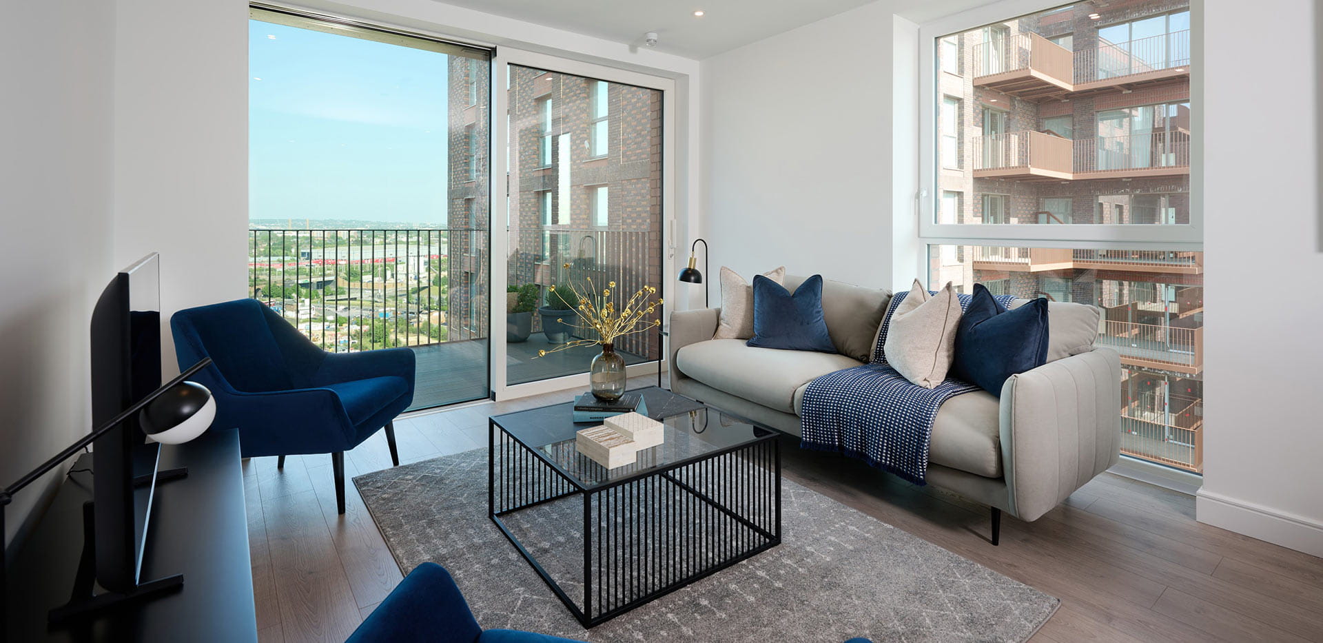 Waterview House open living space with a full width window overlooking Wembley