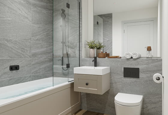 Bathroom with shower over bath, contemporary design.
