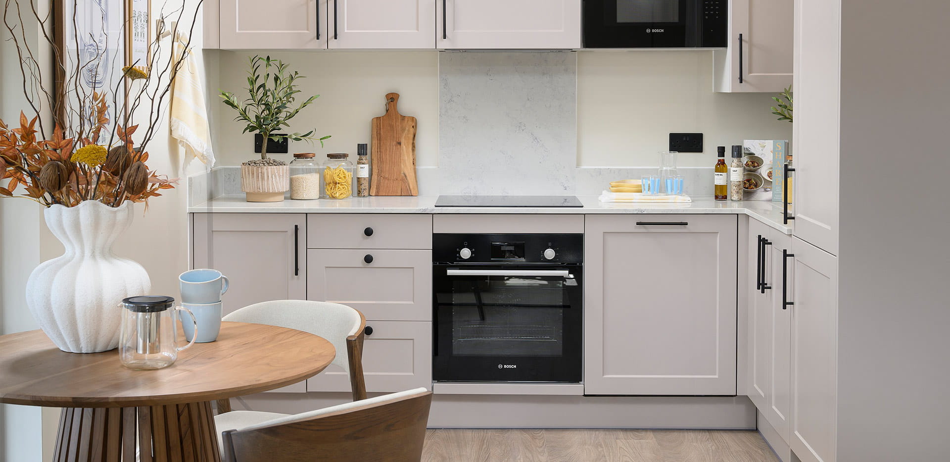 An interior Dining / Kitchen image at the 1 Bedroom Show Apartment at Hartland Village