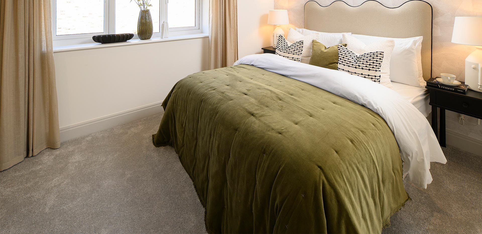 An interior Bedroom image with Green Bedding at the 2 Bedroom Showhome at Hartland Village