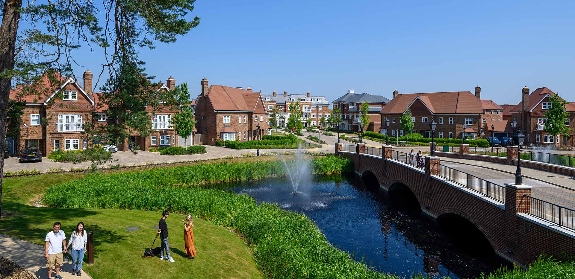 Exterior photo of park and pond at Hartland Village