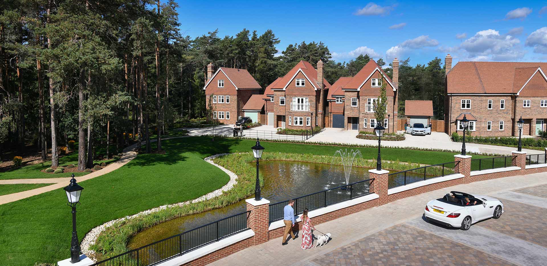 Photo of entrance bridge to Hartland Village with houses in the background