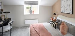 Hartland Village bedroom with a neutral, peach design